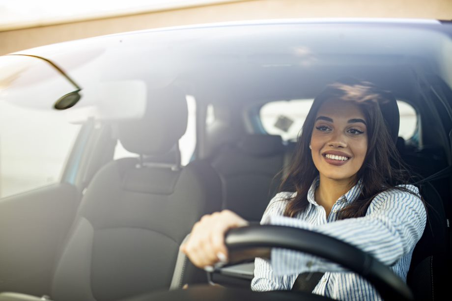 A woman test-driving a vehicle